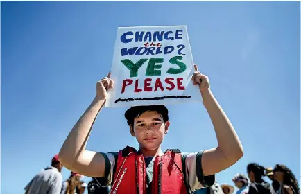  ?? PHOTOS: ANDY JACKSON/STUFF ?? Ngakau Rain, 13, joined a peaceful protest held against seismic surveying off the Taranaki coast at Nga¯motu Beach in New Plymouth.