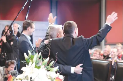  ?? (Axel Schmidt/Reuters) ?? SAME-SEX COUPLE Karl Kreil and Bodo Mende get married at a civil registry office yesterday, becoming Germany’s first married gay couple.