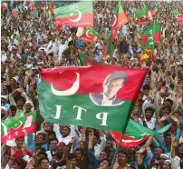 ??  ?? supporters of the Pti attend an election campaign rally by imran khan in Charsadda district. — AFP