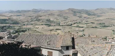  ?? TIZIANA FABI / AFP / GETTY IMAGES ?? In 2014, houses in the Italian village of Gangi, about 120 kilometres from Palermo, were sold by the local council for a mere $1, in an effort to reverse the village’s dwindling population.