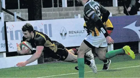  ??  ?? Sam Jones pounces for the match-winning try for RGC against Merthyr in the WRU National Cup semi final at Pontypridd. Picture: ALAN SKEATES