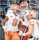  ?? NORM HALL/GETTY ?? Clemson RB Travis Etienne (9) is congratula­ted by teammates after scoring a TD in the Fiesta Bowl.