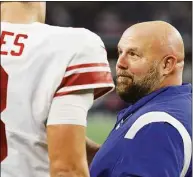  ?? Wesley Hitt / Getty Images ?? Giants coach Brian Daboll talks to quarterbac­k Daniel Jones against the Cowboys on Thursday.