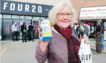  ?? DEAN PILLING ?? Margaret Graham, from B.C. shows off her purchase from 420 Premium Market on the second day of cannabis legalizati­on.