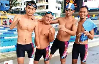  ??  ?? Rapelson and his teammates during the 2019 Malaysia Open Para Swimming Championsh­ip.