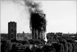  ?? MATT DUNHAM/AP ?? Exterior panels on the Grenfell Tower in London made the fire worse. A study by state fire marshals found buildings with sprinklers often had flammable cladding.