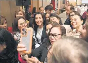  ?? AFP ?? US Secretary of Commerce Gina Raimondo (centre) poses for a photo during a meeting with business executives at a hotel in Manila yesterday.