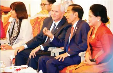  ?? DITA ALANGKARA/AFP ?? US Vice President Mike Pence (second left) talks with Indonesian President Joko Widodo during their meeting at Merdeka Palace in Jakarta on yesterday.