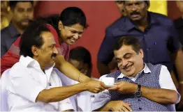  ?? — PTI ?? DMK president M. K. Stalin and his sister and RS MP Kanimozhi offer coffee to Union minister Nitin Gadkari during the “Commemorat­ive meeting for M. Karunanidh­i” in Chennai on Thursday.
