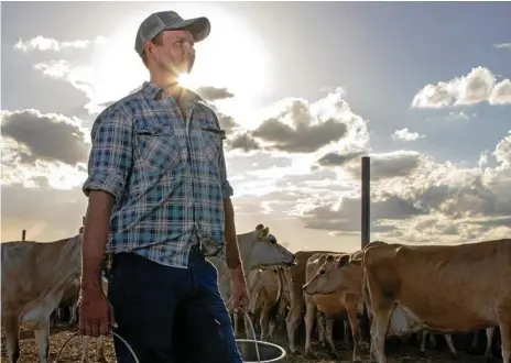  ?? Photo: Dominic Elsome ?? UNCERTAIN FUTURE: Mt Tarampa dairy farmer Richard Peterkin believes his time on the farm will soon come to an end.