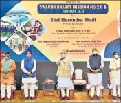  ?? PTI ?? Prime Minister Narendra Modi launches the Swachh Bharat Mission-Urban 2.0 and AMRUT 2.0, in New Delhi on Friday.