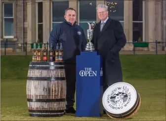  ??  ?? „ Loch Lomond boss Colin Matthews, left, and R&A chief Martin Slumbers unveil the brand’s Open sponsorshi­p.