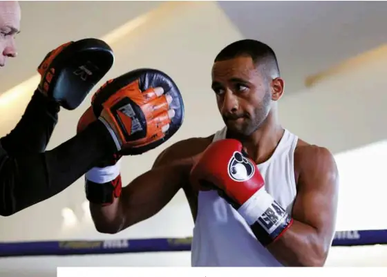  ?? Photos: ACTION IMAGES/ PAUL CHILDS ?? READY FOR ACTION: Galahad on the pads with his trainer, Dominic Ingle