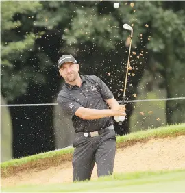  ?? Picture: Gallo Images ?? IN THE RUNNING. Darren Fichardt hits out of a bunker during the second round of the Joburg Open yesterday.