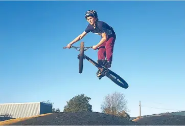  ??  ?? Zathem Williams shows off a trick as he gets some air above one of the jumps at the refurbishe­d Trafalgar BMX track.