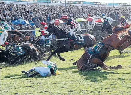  ??  ?? Widening scandal: The Grand National, already controvers­ial over horse fatalities, is now linked to a food scandal.