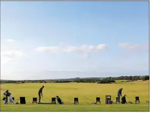  ?? AP/RENEE GRAHAM ?? Golfers practice
on the driving range at the Trump Internatio­nal golf course in Balmedie, Scotland, on Friday. A financial report that Trump’s company filed with the British government shows he has lost millions of dollars at the resort, called the...