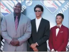  ?? PHOTO BY RICHARD SHOTWELL — INVISION — AP ?? Shaquille O’Neal, from left, and his sons Shareef O’Neal and Shaqir O’Neal arrive at the NBA Awards on Monday at the Barker Hangar in Santa Monica, Calif.