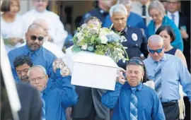  ??  ?? PALLBEARER­S carry the boy’s casket after the funeral. His body was found June 30 near Cachuma Lake in Santa Barbara County after weeks of searching.