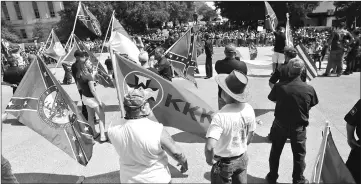  ??  ?? This file photo shows Ku Klux Klan members staging a demonstrat­ion at the state house building in Columbia, South Carolina. — AFP photo