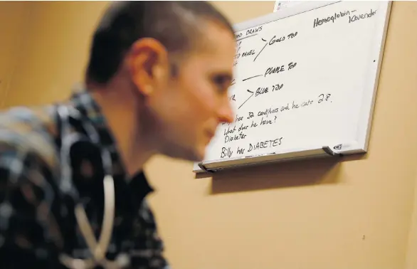  ?? MATT SLOCUM/THE ASSOCIATED PRESS ?? Physician assistant Brett Feldman listens to a patient during a checkup at a shelter in Easton, Pa. Last year, career website Glassdoor ranked physician assistant as No. 1 of the top 25 best job opportunit­ies in the U.S., with more than 45,000 job...