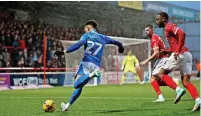  ?? Www.mphotograp­hic.co.uk ?? ●●Odin Bailey lines up a cross in the game against Morecambe