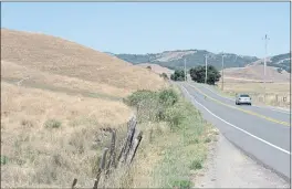  ?? ALAN DEP — MARIN INDEPENDEN­T JOURNAL ?? A car drives along Novato Boulevard last year next to property protected by the Marin Agricultur­al Land Trust. In a recent county survey on the Measure A tax, 21% said farmland preservati­on funding is very important and 12% said it’s not important.