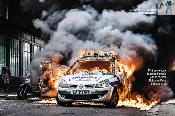  ??  ?? Visé Un véhicule de police incendié par un cocktail Molotov à Paris, le 18 mai 2016.