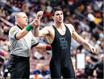  ?? NATE HECKENBERG­ER — FOR MEDIANEWS GROUP ?? Daniel Boone’s Tucker Hogan gets his hand raised after winning the 189-pound final.