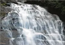  ?? CURTIS COMPTON/AJC FILE ?? Waters that pour over Anna Ruby Falls near Helen in North Georgia soon flow into the Chattahooc­hee River, which is part of the Apalachico­la-chattahooc­hee-flint river basin.