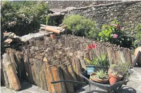  ??  ?? In the village of Casal de Sao Simao, the houses are topped with clay tiles, a traditiona­l roofing material.