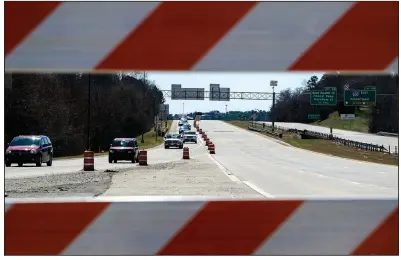  ?? (Arkansas Democrat-Gazette/Stephen Swofford) ?? Cars are diverted off Interstate-40 North on Saturday while the highway is shut down for constructi­on this weekend. Most traffic was diverted through the Pleasant Valley neighborho­od, but large trucks were instructed to turn around and head back south.