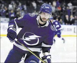  ?? Chris O’Meara The Associated Press ?? Lightning right wing Nikita Kucherov leads the NHL in points (61) and is tied for first in assists (44), giving him the lead in the Hart Trophy race.