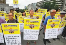  ?? Jung Yeon-Je / AFP / Getty Images ?? South Koreans opposed to the joint U.S.-South Korea military exercises demonstrat­e near the U.S. Embassy in Seoul.