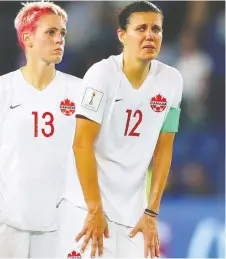  ?? RICHARD HEATHCOTE/GETTY IMAGES ?? Sophie Schmidt, left, and Christine Sinclair look on in tears after losing 1-0 to Sweden on Monday at Parc des Prince in Paris to end their Women’s World Cup bid.