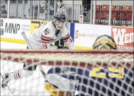  ?? JOEY SMITH/TRURO DAILY NEWS ?? Campbell Pickard of the Bearcats moves in on Mariners goaltender Leif Hertz during Game 4 action in a Maritime Junior Hockey League Eastlink South Division battle on Wednesday. The Bearcats cruised to a 4-0 win to tie the best-of-seven series 2-2.