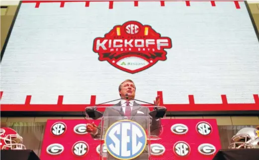  ?? PHOTOS BY THE ASSOCIATED PRESS ?? Georgia coach Kirby Smart speaks Tuesday during SEC Football Media Days in Atlanta. He said last year’s national runner-up finish “was a confidence-builder.”