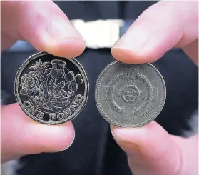  ??  ?? > The new 12-sided £1 coin will replace the old