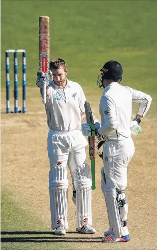  ?? PHOTO: GETTY IMAGES ?? Job well done . . . New Zealand captain Kane Williamson celebrates his secondinni­ngs century with batting partner Henry Nicholls on the fifth day of the first test against Bangladesh at the Basin Reserve yesterday.