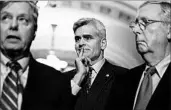  ?? ALEX BRANDON/AP ?? Sen. Bill Cassidy, R-La., center, and Majority Leader Mitch McConnell, R-Ky., listen to Sen. Lindsey Graham, R-S.C.