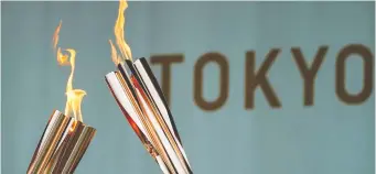  ?? NAOKI OGURA/REUTERS ?? Torches during a lighting ceremony as Tokyo prepares to host the Summer Olympics.