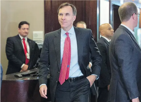  ?? ANDREW VAUGHAN / THE CANADIAN PRESS ?? Bill Morneau heads to the morning session on Wednesday as the Liberal cabinet meets in St. John’s, N.L., where the proposed tax changes have dominated discussion­s ahead of next week’s resumption of Parliament.