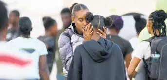  ?? PHOTOS BY GLADSTONE TAYLOR/MULTIMEDIA PHOTO EDITOR ?? MVP athlete Stephenie Ann McPherson (left) speaks with Tia Clayton at the Queens/Grace Jackson Meet, held at National Stadium in St Andrew yesterday.