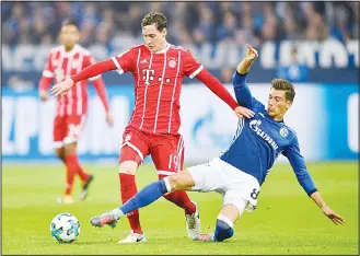  ?? (AP) ?? Bayern’s Sebastian Rudy and Schalke’s Leon Goretzka (right), challenge for the ball during the German Bundesliga soccer match between FC Schalke 04 and Bayern Munich at the Arena in Gelsenkirc­hen, Germany
on Sept 19.