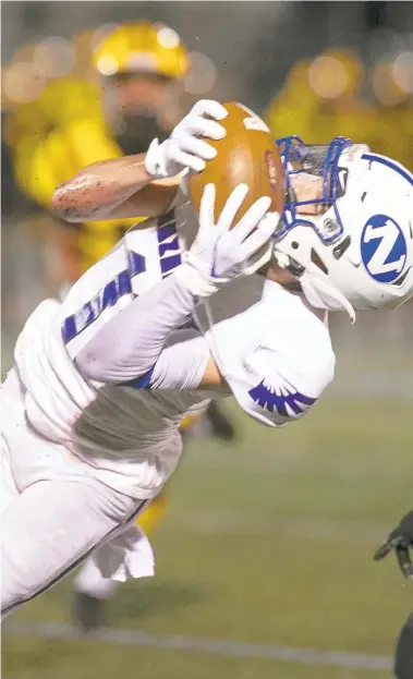  ?? DOUGLAS KILPATRICK/SPECIALTOT­MC ?? Nazareth’s Jaiden Cabrera brings in a long pass, setting up the second Nazareth’s TD in this EPC“Battle of the Unbeatens”Friday night at Bethlehem Area School District Stadium.