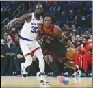  ?? Associated Press ?? The Toronto Raptors’ OG Anunoby (3) drives past the New York Knicks’ Julius Randle (30) during the first half on Monday in New York. The Raptors won 113-104.