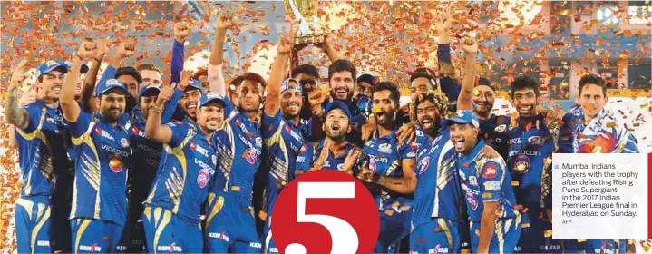  ?? AFP ?? Mumbai Indians players with the trophy after defeating Rising Pune Supergiant in the 2017 Indian Premier League final in Hyderabad on Sunday.