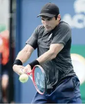  ?? CHARLES TRAINOR JR. ctrainor@miamiheral­d.com ?? Marcos Giron follows through on a backhand in his 7-6 (7-5), 6-4 win over Tommy Paul on Wednesday.
