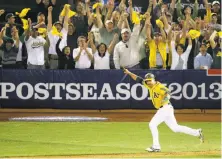  ?? Jeff Chiu / Associated Press 2013 ?? Stephen Vogt’s walk-off single off Detroit’s Rick Porcello in Game 2 of the 2013 AL Division Series was a playoff highlight.