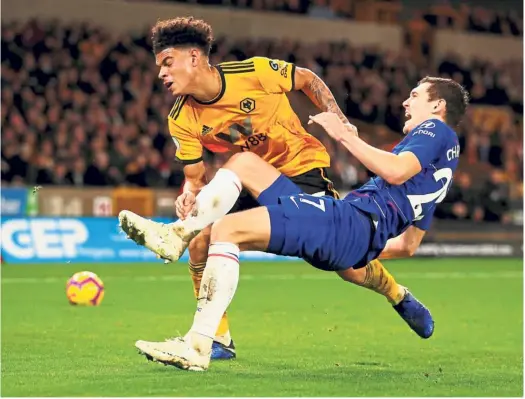  ?? — Reuters ?? Too rough: Chelsea’s Andreas Christense­n (right) is fouled by Wolves’ Morgan GibbsWhite during the English Premier League match at the Molineux Stadium on Wednesday.